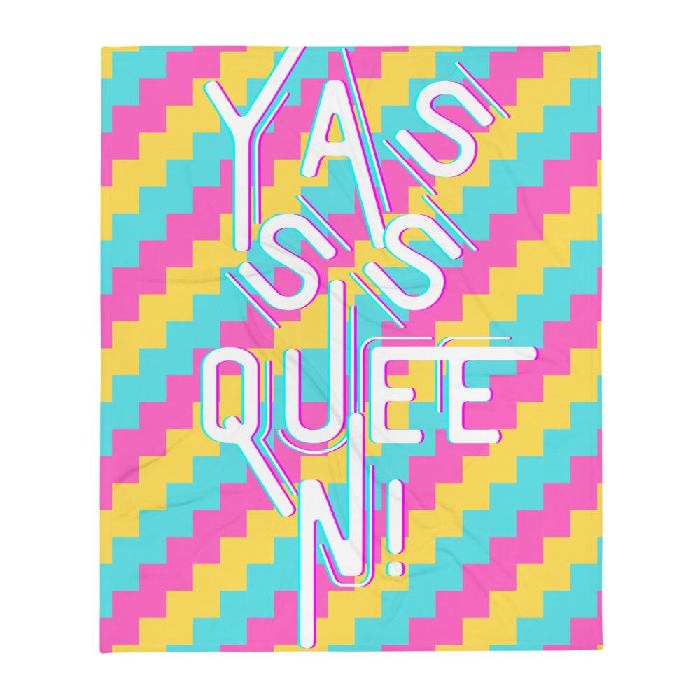 Throw blanket with colorful zigzag pattern and large white “Yasss Queen!” lettering