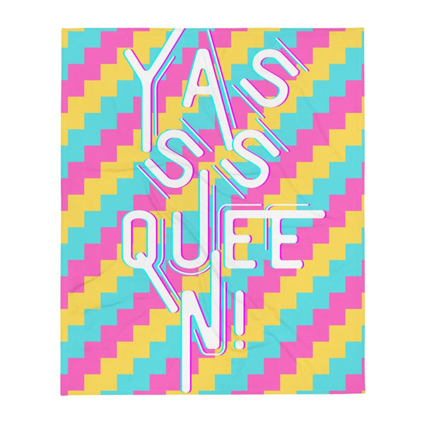Throw blanket with colorful zigzag pattern and large white “Yasss Queen!” lettering
