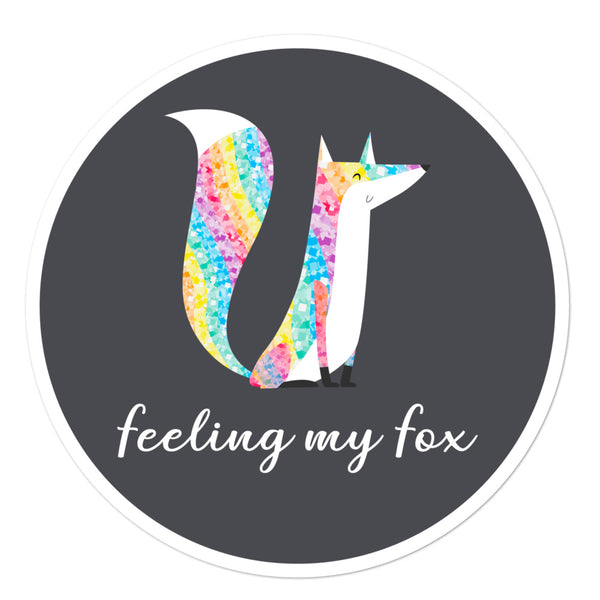 Round sticker with a colorful glitter-style fox and the words “feeling my fox”