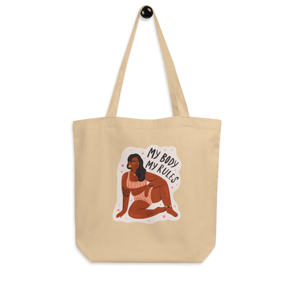 Front-facing beige tote bag with an illustrated woman and “MY BODY MY RULES” text