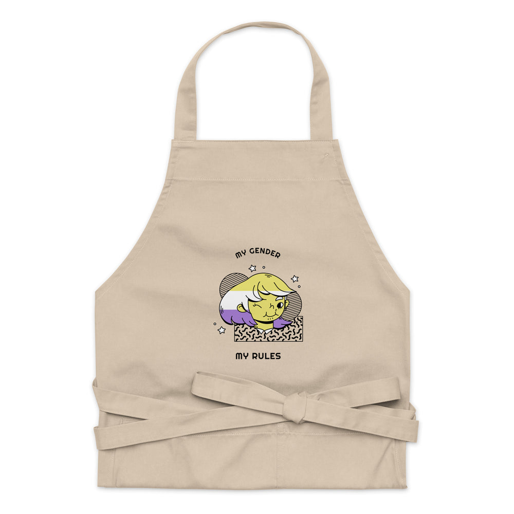 Front view of a beige apron reading “MY GENDER” and “MY RULES,” with a cartoon portrait