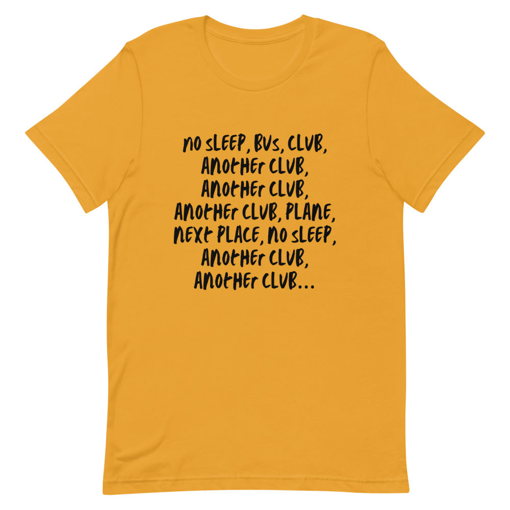 Flat-lay mustard yellow T-shirt with black text reading “No Sleep, Bus, Club, Another Club…”