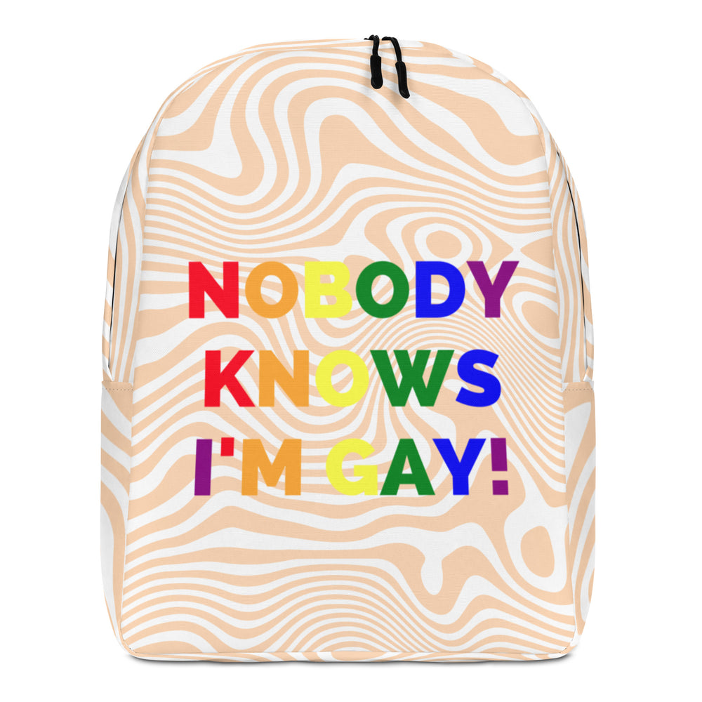 Front view of a beige-and-white wavy-pattern backpack reading “NOBODY KNOWS I’M GAY!”
