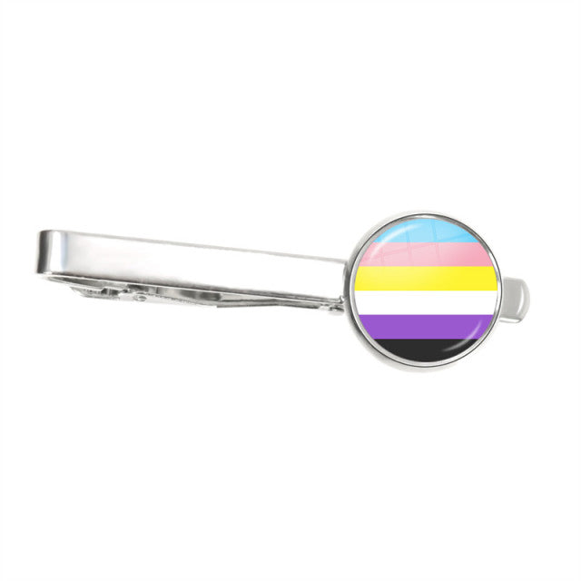 Silver tie clip with a round nonbinary pride flag design on the front