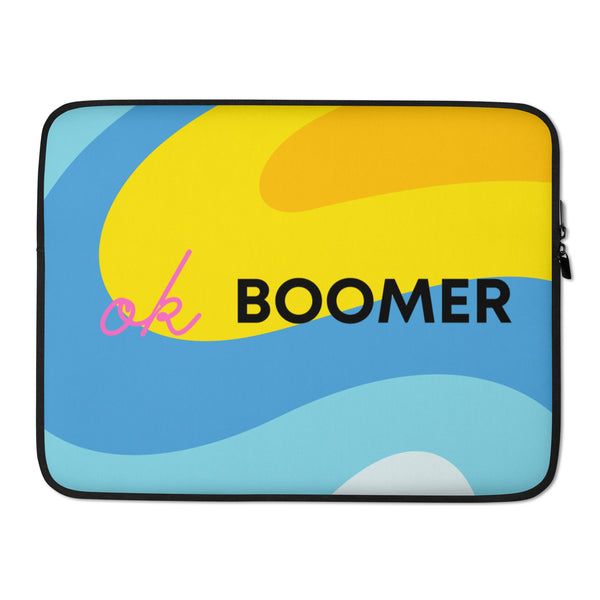 Laptop sleeve with colorful blue and yellow waves, pink script, and bold black “BOOMER” text