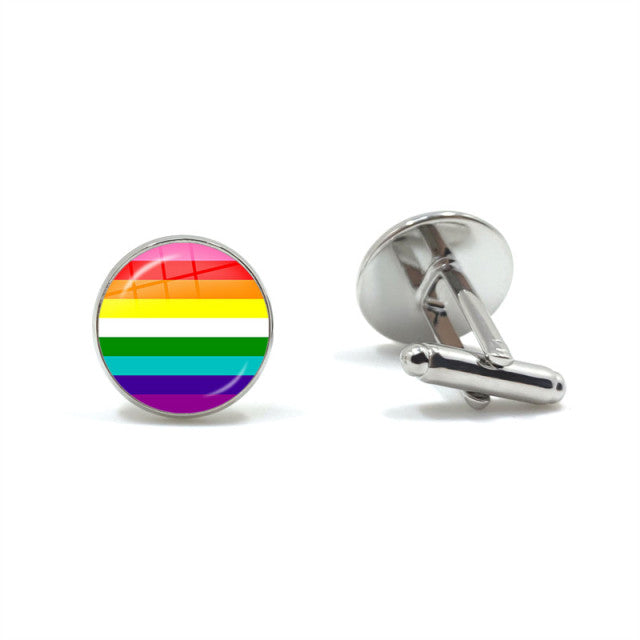 Pair of silver cufflinks, one showing a rainbow-striped circular face and one turned sideways