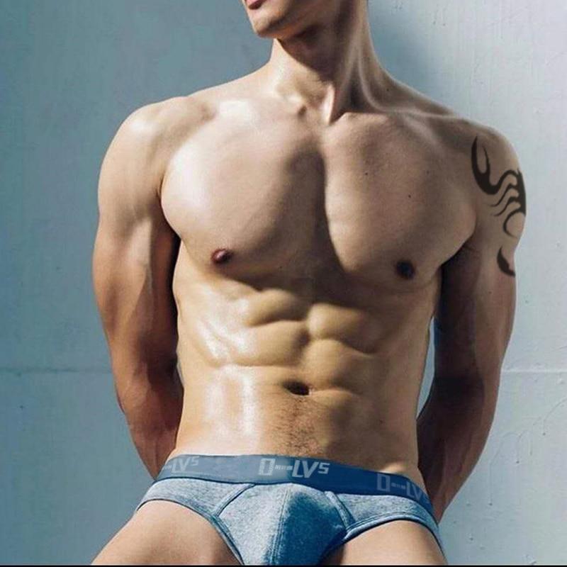 Model wearing light blue denim-look briefs with a dark blue branded waistband