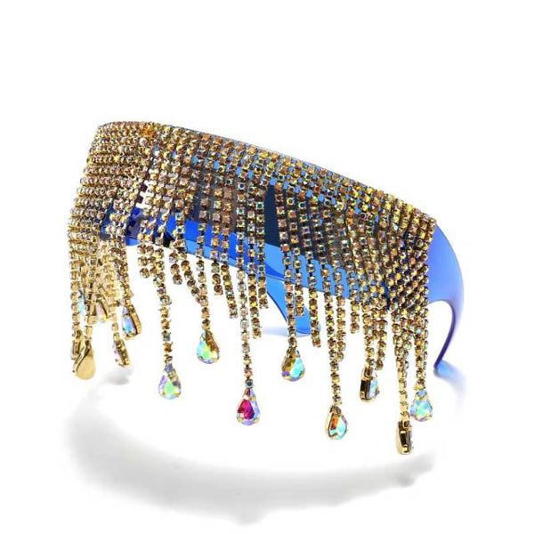 Close-up of oversized crystal sunglasses with gold rhinestone tassels and multicolor teardrop gems
