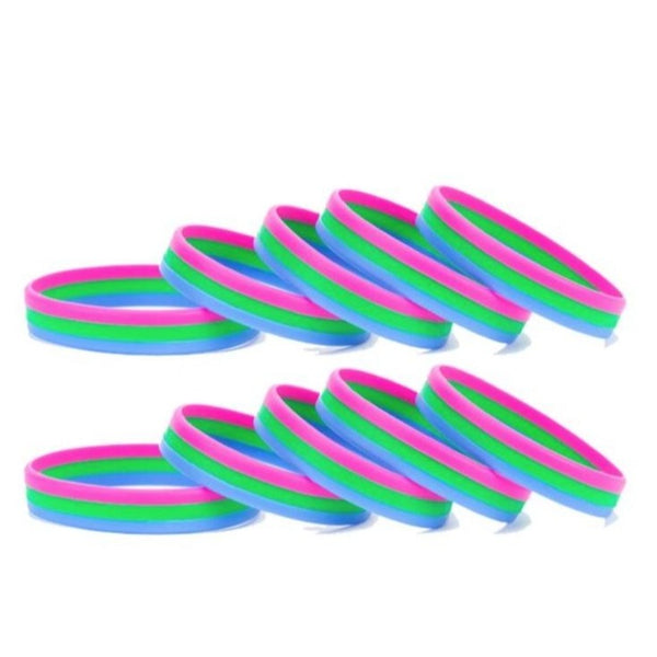 Five stacked polysexual pride rubber wristbands in pink, green and blue stripes