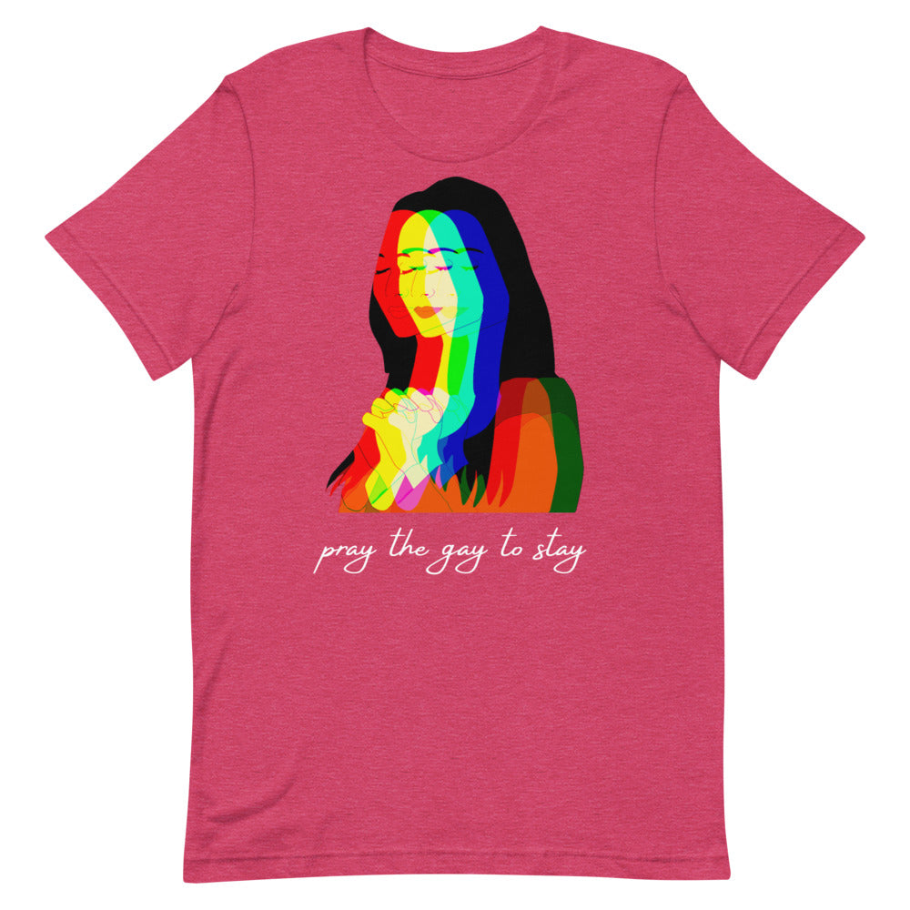 Flat-lay raspberry T-shirt with a rainbow portrait and “pray the gay to stay” text