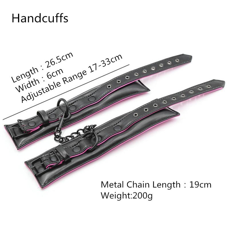 Black leather-look handcuffs with pink trim, metal chain, and adjustable buckle straps