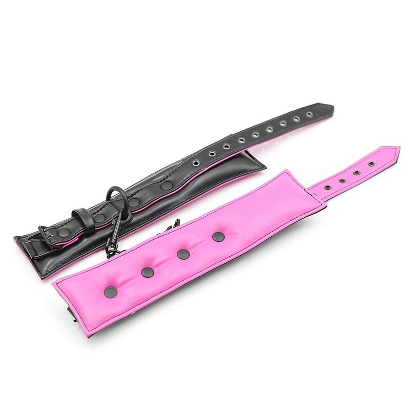 Black and pink adjustable pup play collars with metal rings and snap closures