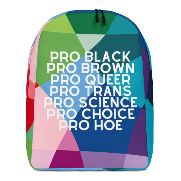 Front view of a colorful geometric backpack reading “PRO BLACK PRO BROWN PRO QUEER PRO TRANS PRO SCIENCE PRO CHOICE PRO HOE”