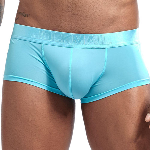 Close-up front view of turquoise JOCKMAIL ultra-thin boxer briefs with a contoured pouch