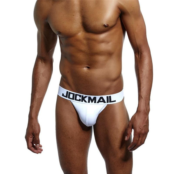 Model wearing a white Jockmail jockstrap with a wide branded waistband