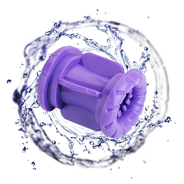 Purple dual-channel male masturbator shown at an angle amid a splash of water