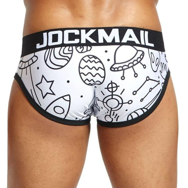 Model wearing white space-print briefs with a black JOCKMAIL waistband