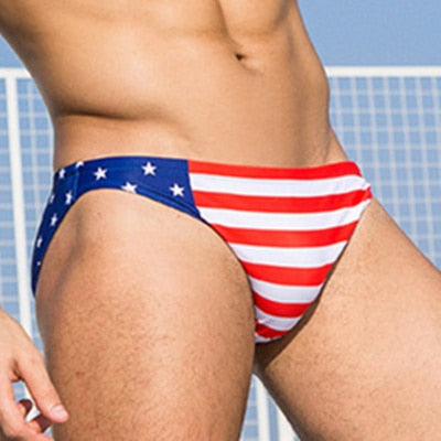 Close-up model wearing an American flag print swim brief