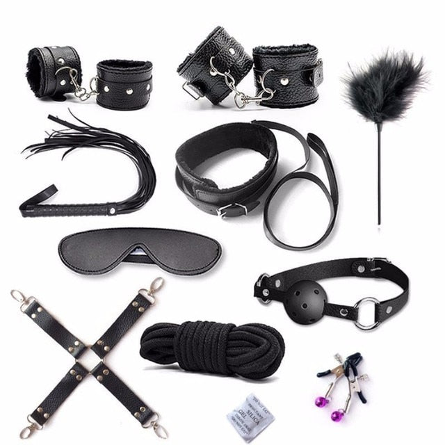 Flat lay of black BDSM starter kit arranged in a flat lay; BDSM fetish starter kit