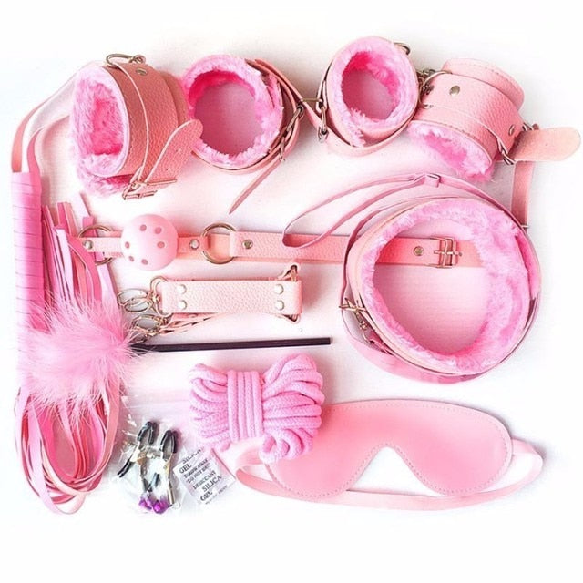 Flat lay of pink BDSM starter kit; BDSM fetish starter kit