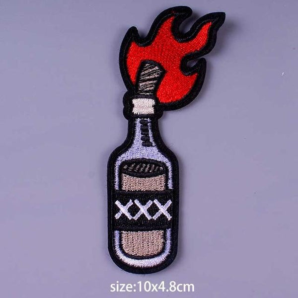 Embroidered Molotov cocktail patch with red flames and XXX bottle label
