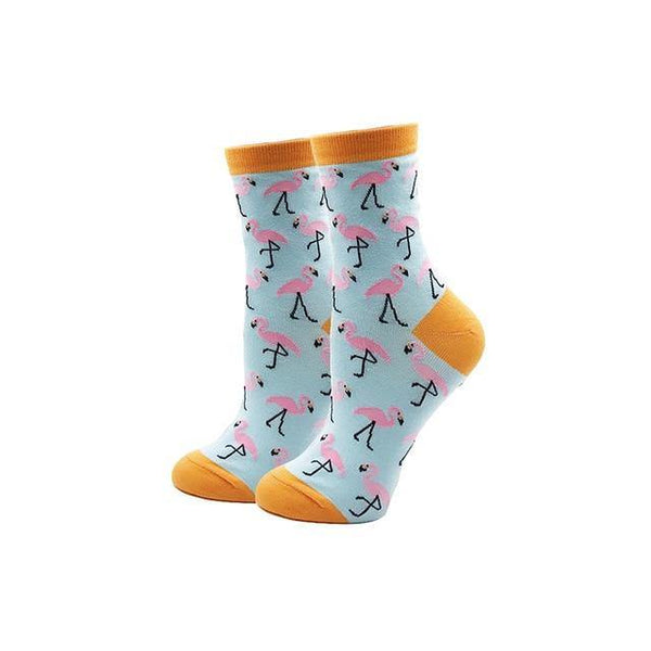 Pink flamingo ankle socks with orange cuffs, toes, and heels on a white background