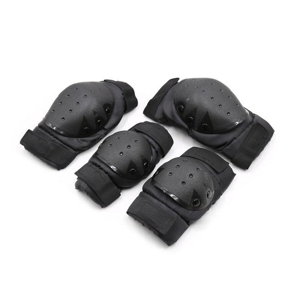 Close-up of four black protective pads with adjustable straps and ventilated hard-shell caps