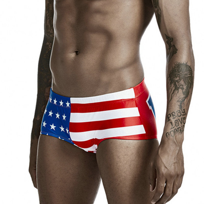 Front view of a model wearing American flag-patterned swim briefs