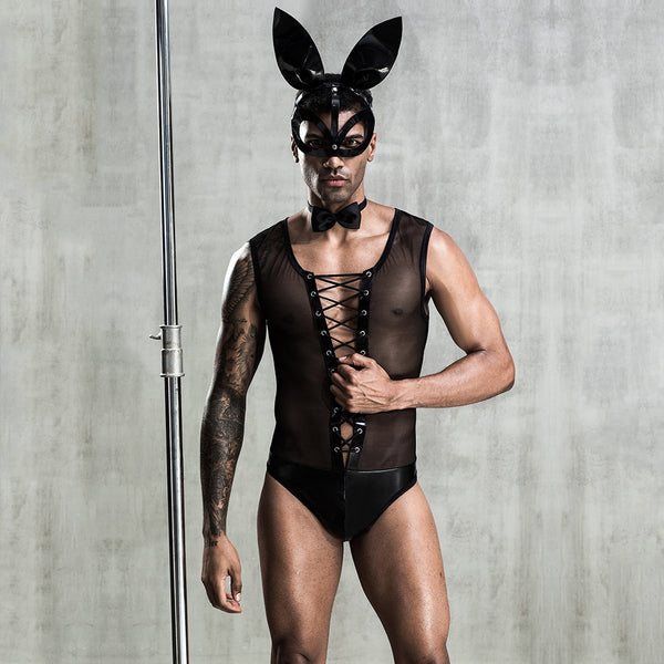Model wearing a black rabbit costume with ears, mask, bow tie, mesh top and briefs