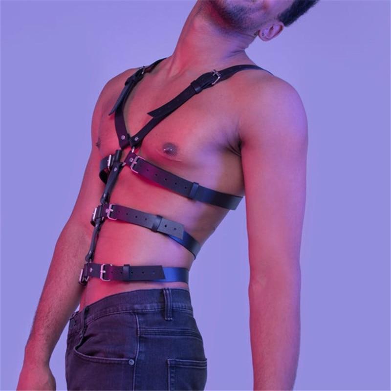 Black leather full-body harness with buckled straps worn across a model’s torso