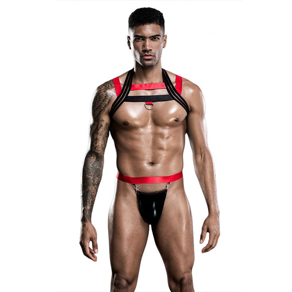 Model wearing a black and red chest harness with O-ring and black pouch jockstrap