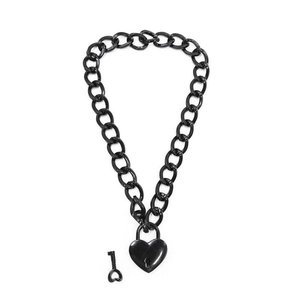 Close-up of a black chain fetish collar with a heart-shaped padlock and separate key
