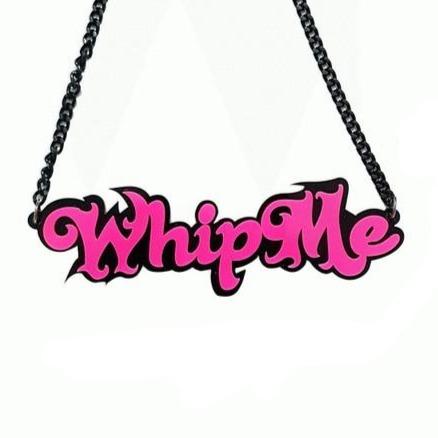 Pink-and-black “Whip Me” acrylic statement necklace on a black chain