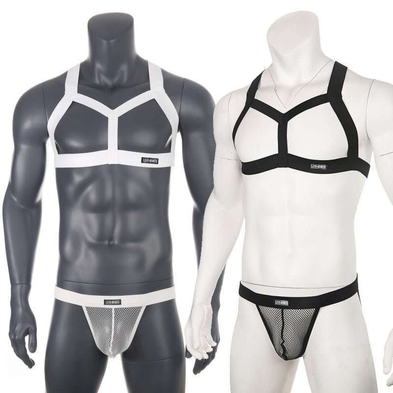 Two mannequins wearing contrasting black-and-white chest harnesses and mesh jockstraps