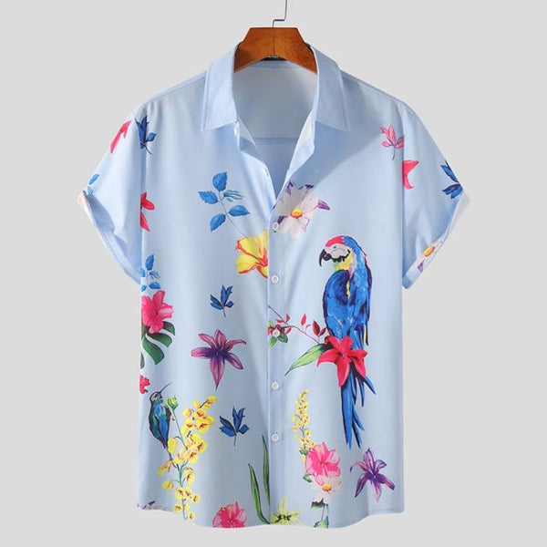 Light blue short-sleeve button-up shirt with a colorful parrot and tropical flowers