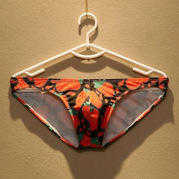 Strawberry-print briefs with sheer gray mesh side panels, hanging on a white hanger