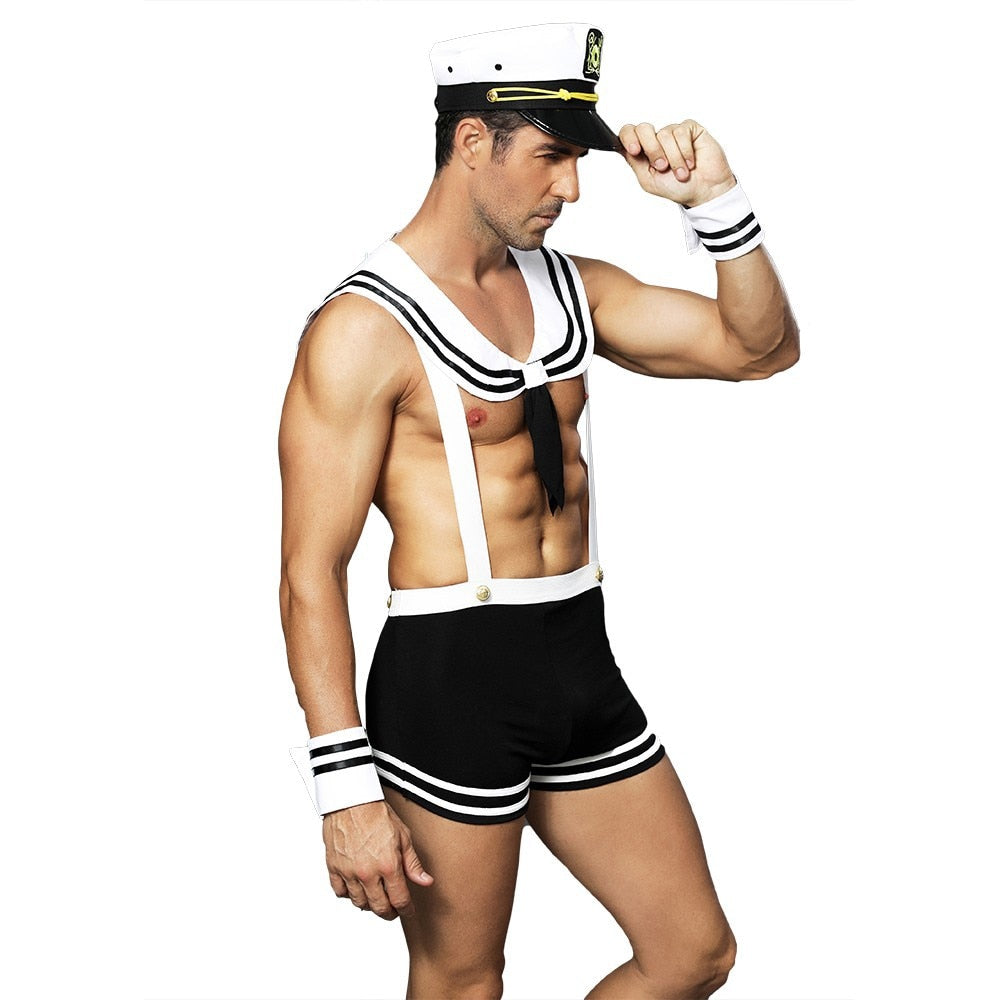 Model wearing a black-and-white sailor costume with cap, neckerchief, shorts, and wrist cuffs