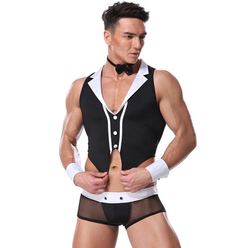Model wearing a black-and-white male maid costume with cropped vest, bow tie and mesh briefs