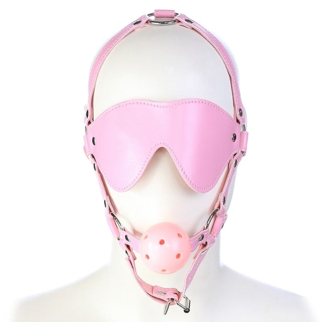 Front-view pink BDSM hood with eye covering and ball gag on a mannequin