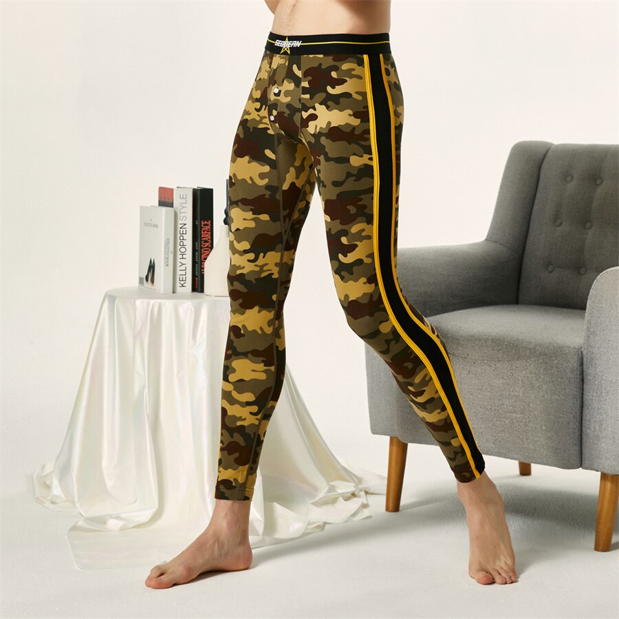 sexy twinks in underwear: Seobean camo workout leggings with bold yellow side stripes, worn by a barefoot, shirtless person