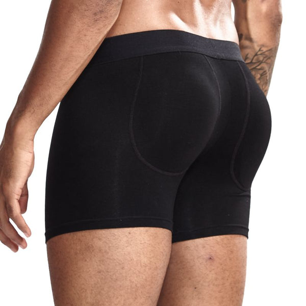 Rear view of a model wearing black fitted booty-enhancing boxer briefs