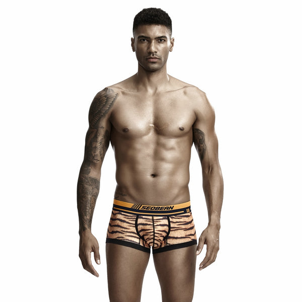 Model wearing tiger-print boxers with a black-and-gold Seobean waistband