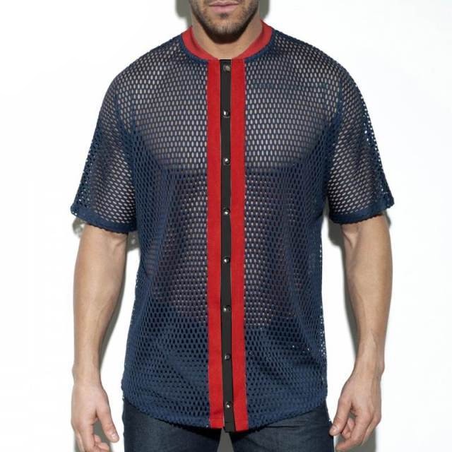 Front view of a model wearing a navy mesh short-sleeve shirt with red trim and black buttons