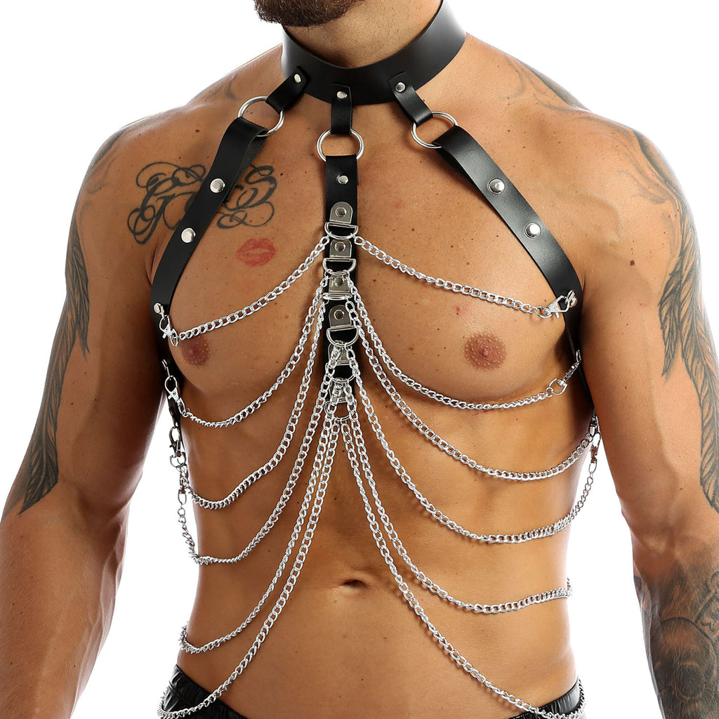 Front view of a shirtless model wearing a black leather and silver chain chest harness