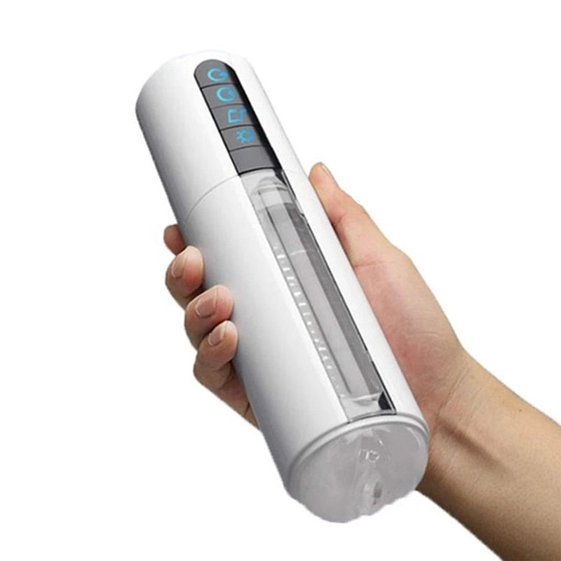 White cylindrical hands-free penis massager held diagonally in one hand