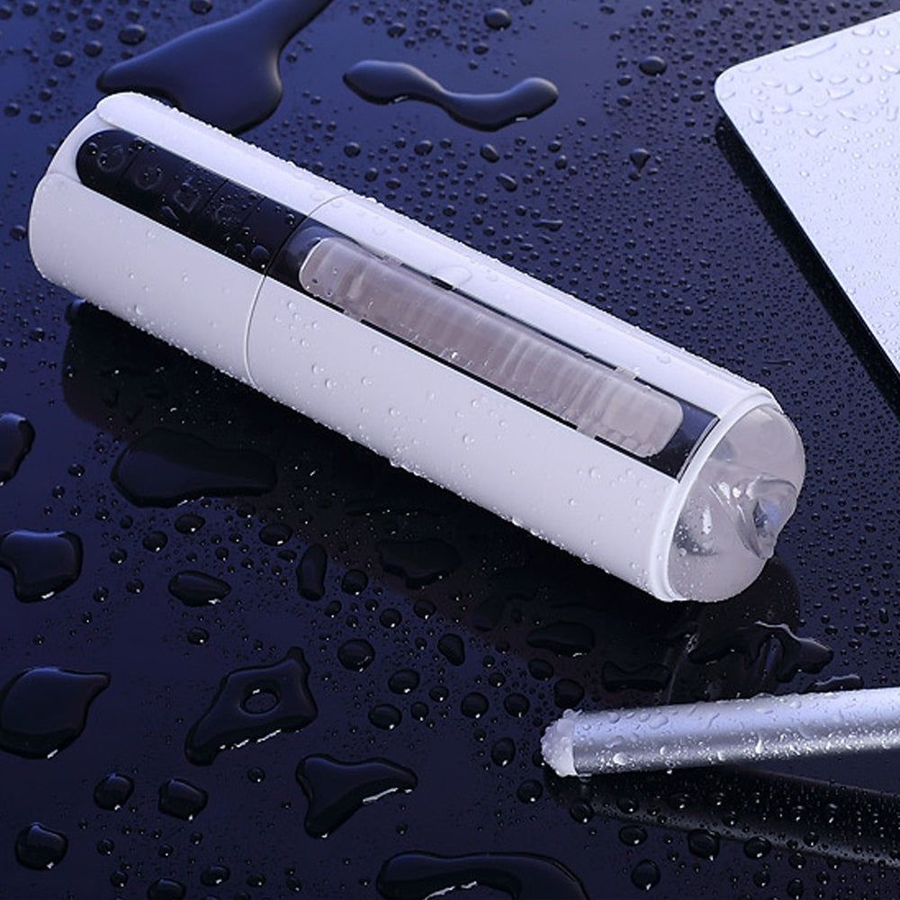 White cylindrical hands-free penis massager with a clear textured sleeve, shown wet at an angle