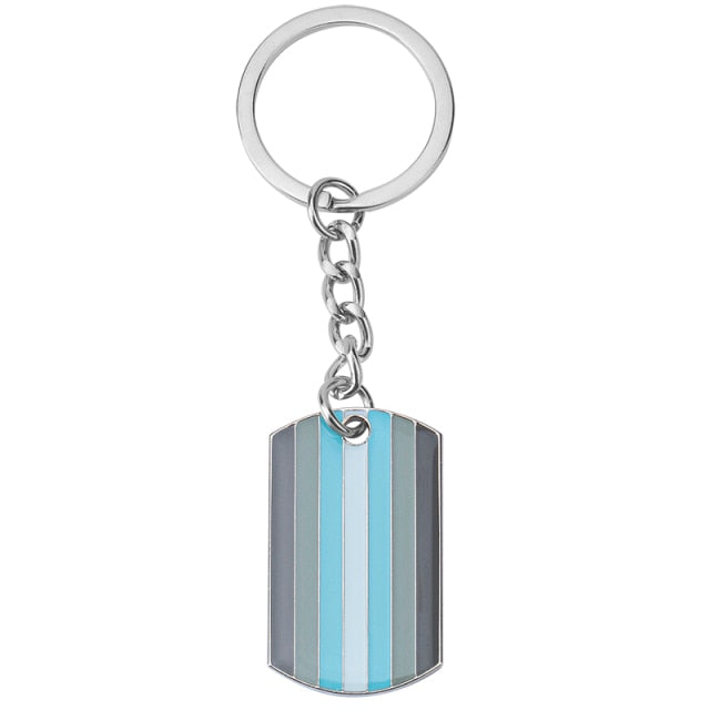Silver keychain with a striped demiboy pride flag tag on a white background