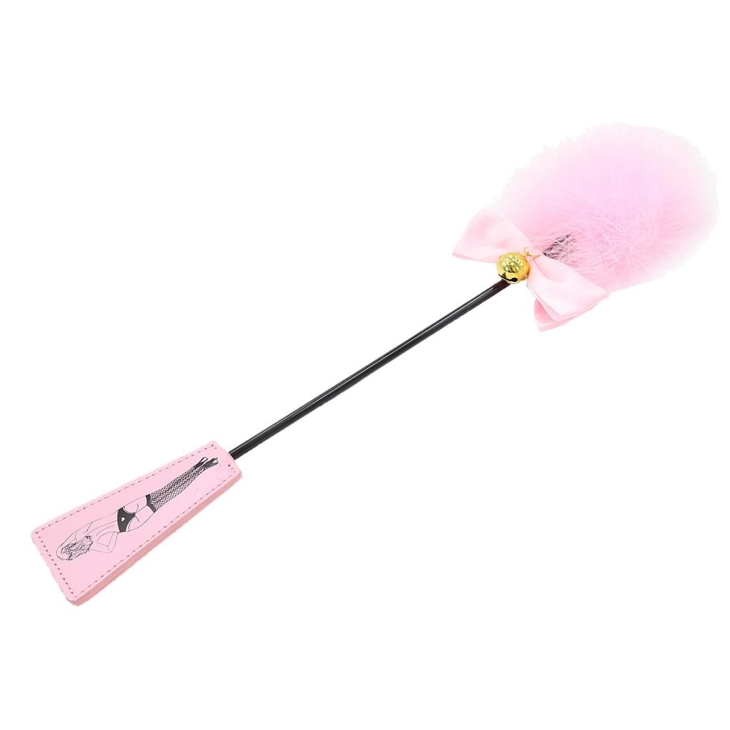 Pink feather-tipped whip with a black handle and illustrated pink grip