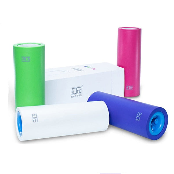 Four colorful cylindrical penis delay trainers beside a white product box