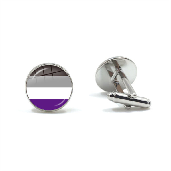 Pair of silver cufflinks, one showing a black, gray, white, and purple striped face